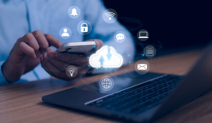 User interacts with a smartphone and a laptop, showing cloud computing, data transfer, and digital services with glowing icons for security, connectivity, and communication. Modern technology concept.