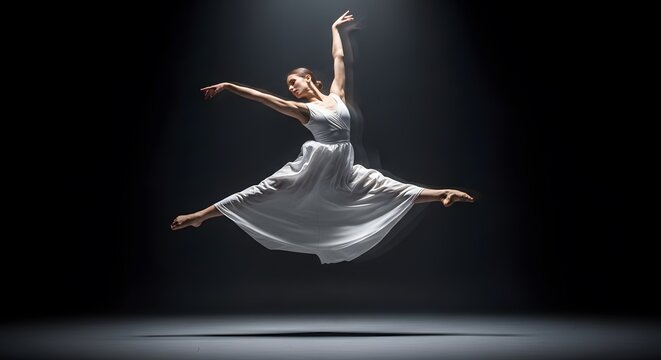 Graceful female dancer performing grand jeté in flowing white dress ballet modern movement elegance freedom spotlight artistic power - Powered by Adobe