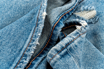 Fototapeta premium Texture from torn pieces of denim. Jeans texture. Material for sewing clothes