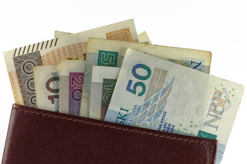 A few banknotes of Polish zlotys are sticking out of your wallet
