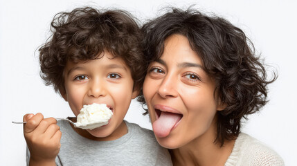Modern indian boy eating ice cream pudding with his mother, happy moment