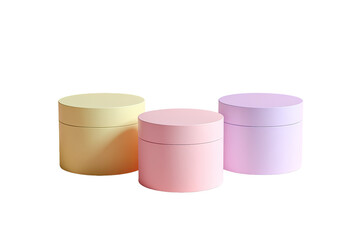 Three pastel-colored cylindrical containers, likely for cream or lotion, arranged horizontally