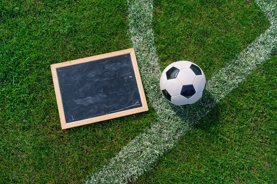 Tactic plan, soccer ball and referee whistle. Hand drawn strategy scheme sketch, isolated on on the black chalkboard. - Powered by Adobe