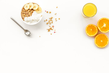 Healthy granola and orange juice for colorful breakfast on white background top view mock-up