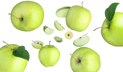 Fresh green apples swirling in air against white background