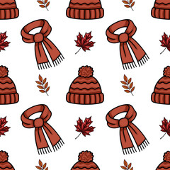 Seamless vector pattern featuring hand-drawn autumnal elements: cozy knitted hats with pom-poms, warm scarves, and vibrant maple leaves, creating a charming and repetitive design.