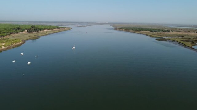 Boats anchored in marismas del Odiel. That is a sandy ecosystems of a wetland area at the mouth of the river Odiel