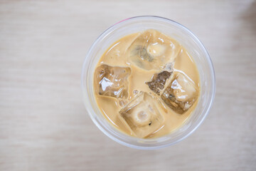 Detailed top view of a clear plastic cup not a lid, containing iced coffee, ideal for advertising