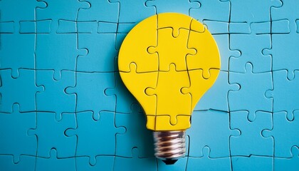 jigsaw puzzle with a yellow light bulb flat lay
