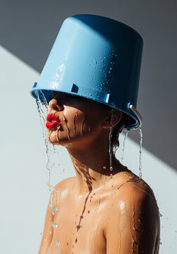 Woman with Blue Bucket on Head, Water Pouring