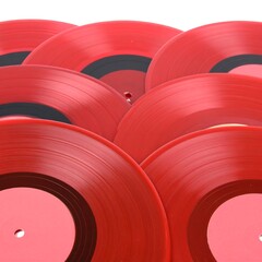 Close-up view of red vinyl records
