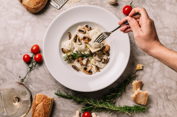 hand holding a plate with food
