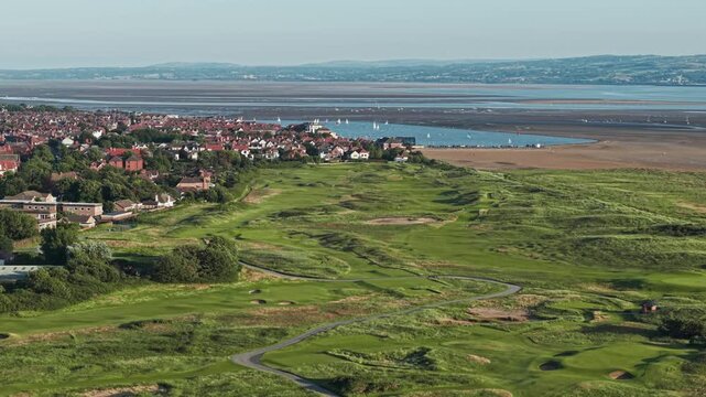 Aerial view of West Kirby village and the Royal Liverpool Golf club links, Hoylake, Wirral, Merseyside, England