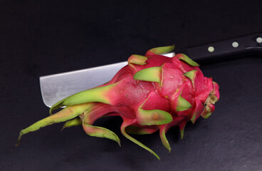 Dragon Fruit in a black background.