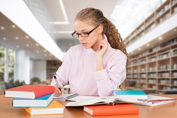 University student studying research in library