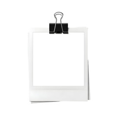 Blank white Polaroid style instant photo frame clipped by a black binder clip isolated on white background