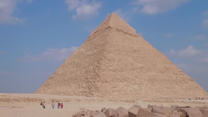 Majestic view of the Great Pyramid of Giza, the largest and oldest of the three pyramids at the Giza Necropolis in Egypt, standing tall under a clear blue sky.