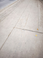 Cracked and damaged concrete sidewalk needs repairing Vysocany Kolbenova 