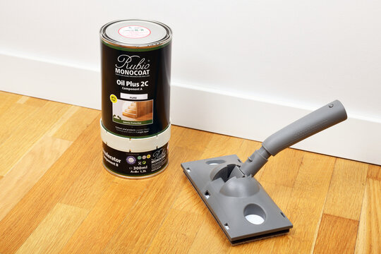 Rubio Monocoat Oil Plus 2C natural hard wax oil stands on the floor.
