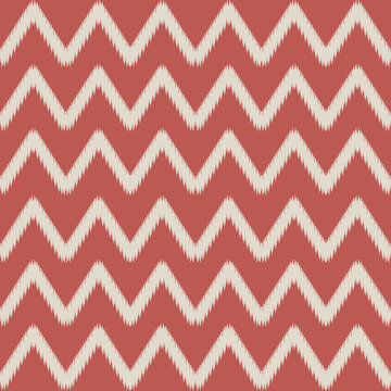 Abstract chevron pattern in a tribal ikat style, featuring a rustic, hand-woven texture. The seamless design with zigzag lines is ideal for textiles, backgrounds, and decorative surfaces.