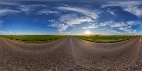 hdri 360 panorama view on crossroads of gravel country roads among fields with clouds in sky in...