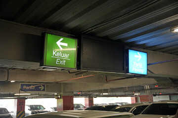 Exit sign and also parking sign in Car Parking area on the ceiling.