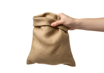 Hand holding a brown burlap sack isolated on transparent background