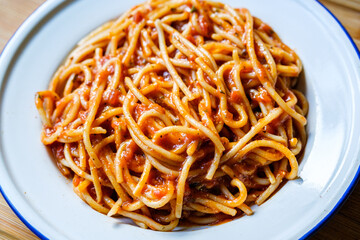 London UK, September 01 2025, Plate of Classic Italian Style Spaghetti Pasta In A Basil and Tomato Sauce With No People
