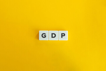 GDP Letters on White Tiles with Yellow Background