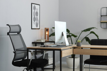 Stylish workplace with modern computer and on wooden table in office