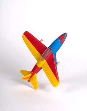 Colorful toy airplane against white background