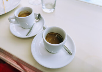 Obraz premium Italian coffee culture with espresso and cappuccino served in white cups, symbol of relaxation, energy, and authentic morning rituals