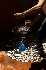 High-speed capture of a water balloon being popped with a knife, showing water splash and frozen motion. Perfect for concepts of summer, fun, energy, action, and refreshing moments