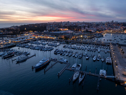 Cascais Port Marine at Night after sunset, Blue Hour, Twilights. Aerial, Illuminated City of Cascais, Lisbon, Portugal - Powered by Adobe