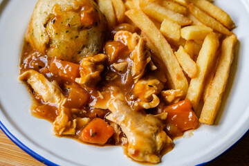 Classic Delicious Chicken Casserole With a Suet Dumpling And Gravy With Chips