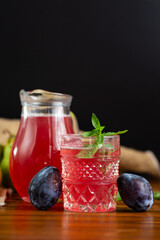 Fresh fruits and a drink from the harvest on a black isolated background