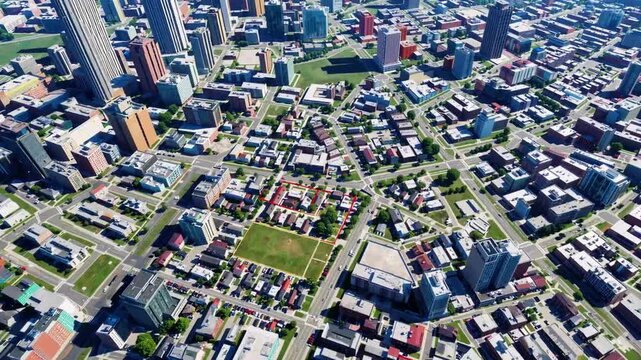 The concept of territorial administration illustrated with theoretical property map showing available undeveloped land for construction against urban backdrop