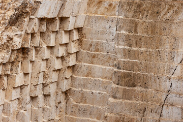 Abstract view of a stepped white stone quarry with geometric layers, sunlight casting soft shadows, minimalistic and bright composition