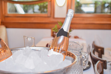 Bottles of Rosé Wine in Ice Cubes at Restaurant
