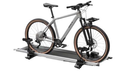 Gray e-bike secured on a silver bike rack