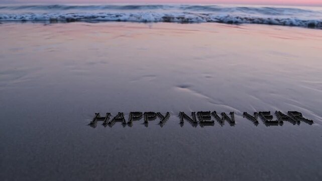 Engraved Greeting For The Upcoming Year Along The Coastal Shoreline