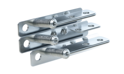 Three stacked metal brackets,  showing screws and mounting holes