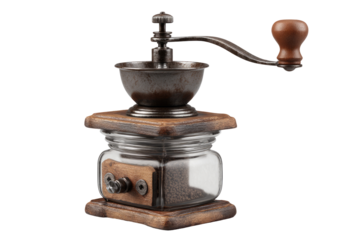 Antique coffee grinder with wooden base and metal components.  Dark brown, metal grinder with wooden handle.  Clear glass container holds coffee beans.  Isolated on black