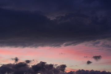 Dramatic Sunset Sky with Dark Clouds and Pink Hues