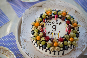 The &ldquo;Vova 9 years&rdquo; message is highlighted by multicolored candles, making it a cheerful centerpiece for a birthday party