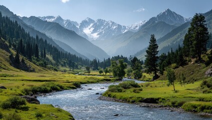 Mountain valley with a crystal-clear river winding through lush greenery. Snow-capped peaks in the background