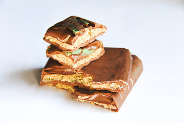 Broken stacked Dubai chocolate dessert pieces