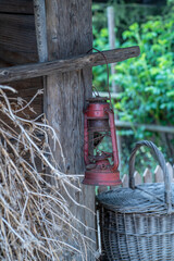 Rustic Red Lantern Hanging on Wooden Wall – Countryside Still Life