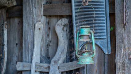 Vintage Green Lantern and Old Washboard on Rustic Wooden Wall – Country Still Life