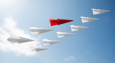 Red paper airplane leads a formation of white planes soaring through a clear blue sky with clouds